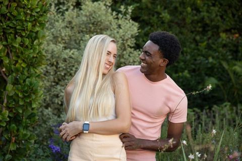 Diverse Couple Embracing in Garden, Happiness and Connection