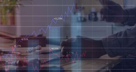 Analyzing Financial Charts in Modern Office