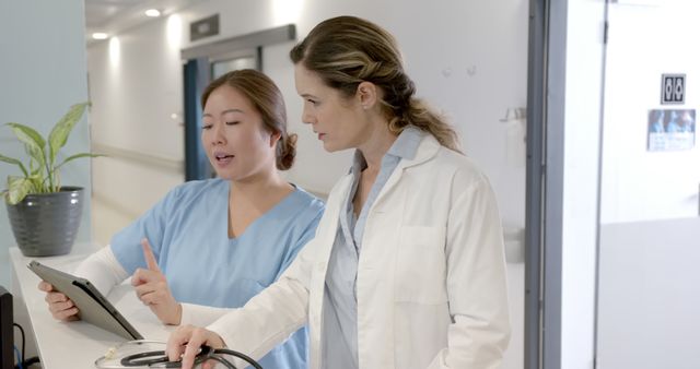 Nurses Collaborating on Patient Care in Hospital Corridor - Download Free Stock Images Pikwizard.com