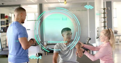 Trainers using tablet hud to monitor client biometrics during rehab and strength assessment