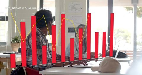 Collaborative team analyzing quarterly revenue with augmented reality bar chart overlay