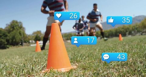 Male rugby players sprinting through cone drill with social media like overlays