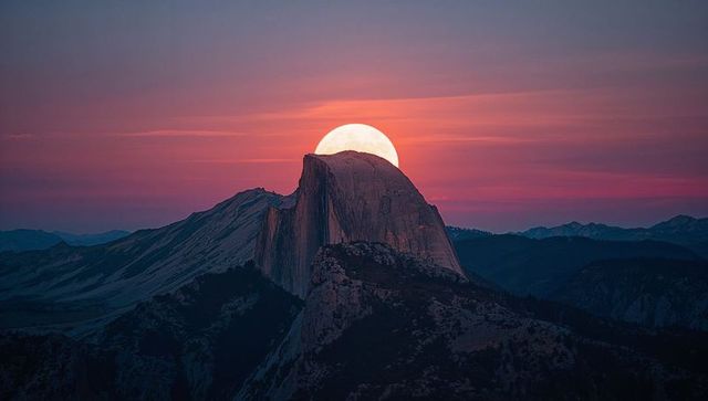 Enchanted twilight moonrise over majestic granite dome