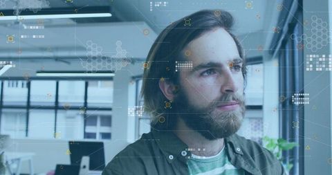 Gazing bearded man with hud data overlay in modern minimalist office workspace