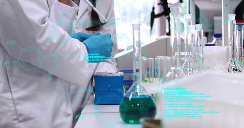 Pipetting scientist wearing blue gloves at lab bench with glassware and molecular overlays