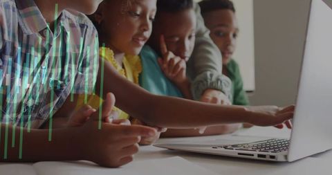 Teacher Guiding Group of Children Around Laptop for Collaborative Learning