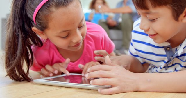 Happy Children Playing Educational Game on Tablet at Home - Download Free Stock Images Pikwizard.com