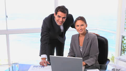 Professional Office Team Smiling in Modern Workspace