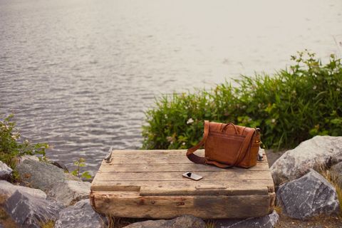 Vintage Leather Bag and Smartphone by Lakeside