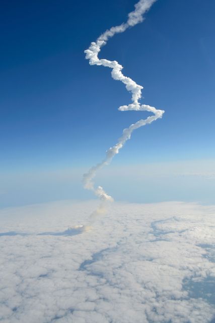 STS134-S-065 (16 May 2011) --- Photographed from a shuttle training aircraft, space shuttle Endeavour and its six-member STS-134 crew head toward Earth orbit and rendezvous with the International Space Station. Liftoff was at 8:56 a.m. (EDT) on May 16, 2011, from Launch Pad 39A at NASA's Kennedy Space Center. Onboard are NASA astronauts Mark Kelly, commander; Greg H. Johnson, pilot; Michael Fincke, Andrew Feustel, Greg Chamitoff and European Space Agency astronaut Roberto Vittori, all mission specialists. STS-134 will deliver the Alpha Magnetic Spectrometer-2 (AMS), Express Logistics Carrier-3, a high-pressure gas tank and additional spare parts for the Dextre robotic helper to the International Space Station. STS-134 is the final spaceflight for Endeavour. Photo credit: NASA