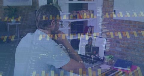 Senior Professional Analyzing Financial Data on Laptop in Home Office