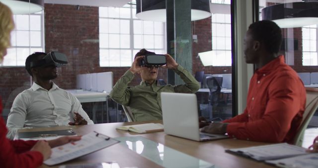 Diverse group of business colleagues sitting in meeting room using vr headset - Download Free Stock Photos Pikwizard.com