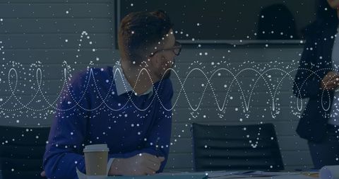 Office Colleagues in Professional Discussion with Digital Overlay