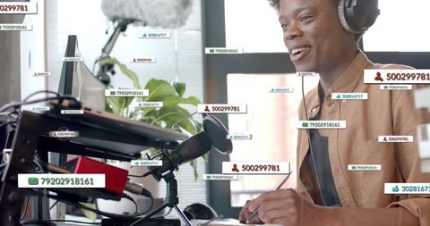 African American Businessman Analyzing Multiscreen Data