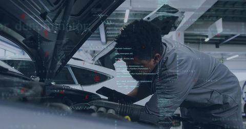 Technician Performing Digital Engine Diagnostics Under Open Hood Using Mobile Device