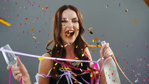 Joyful Woman Celebrating with Confetti and Cheers