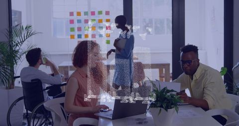 Diverse Team Collaborating in Modern Office with Technology Overlay