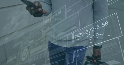 Businessman holding smartphone with digital interface overlay