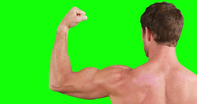 This image shows a muscular man flexing his arm muscles from the back on a green screen background. This can be ideal for fitness campaigns, advertisements promoting gym services, and health or workout-related articles. The green screen makes it suitable for customization and adding different backgrounds in post-production.