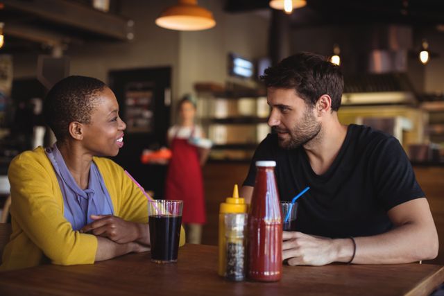 Couple interacting with each other at restaurant