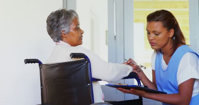 Nurse providing care to elderly woman in wheelchair - Download Free Stock Images Pikwizard.com