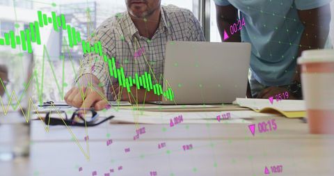 Business Colleagues Analyzing Financial Graphs and Data