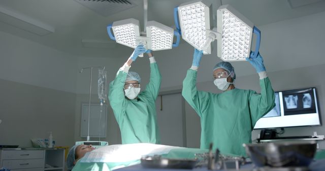 Surgeons Adjusting Lights Before Surgery - Download Free Stock Images Pikwizard.com