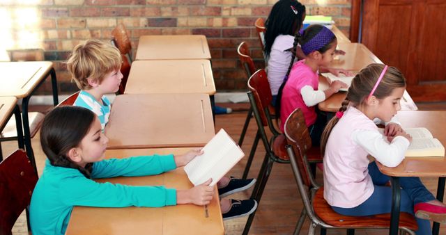 Group of children reading books in classroom - Download Free Stock Images Pikwizard.com