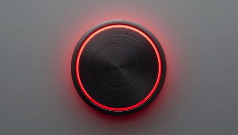 Glowing red led metallic control knob on minimalist gray panel modern rotary dial