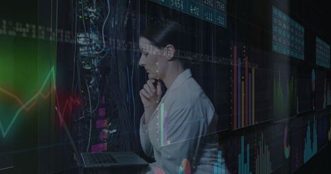 Business analyst reviews financial data in high-tech data center