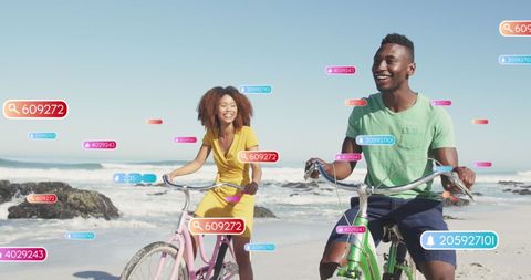 Couple biking on beach surrounded by social media elements
