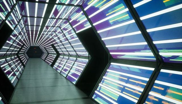 Futuristic Hexagonal Tunnel Guiding Viewer with Backlit Geometric Panels and Red LEDs