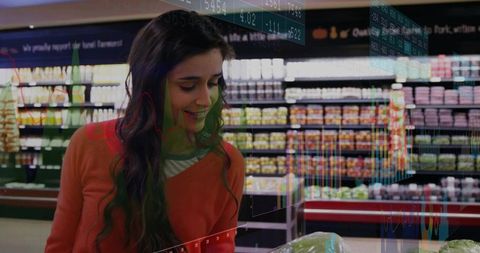 Smiling Shopper Choosing Fresh Lettuce in Supermarket Aisle