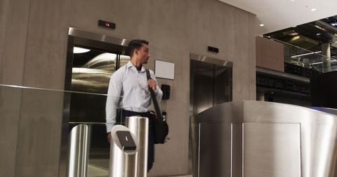 Business Professional Waiting at Office Lobby Turnstile