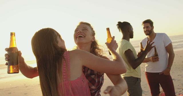 Friends Enjoying Beach Party at Sunset with Drinks - Download Free Stock Images Pikwizard.com