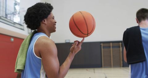 Young athletes warming up on indoor basketball court