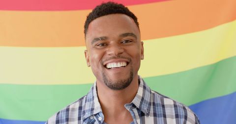 Joyful Man Celebrating LGBTQ+ Pride with Rainbow Flag - Download Free Stock Images Pikwizard.com