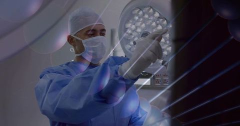 Surgeon adjusting led operating light in sterile or while wearing surgical gown and mask