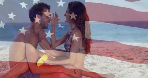 Young couple enjoying beach day america theme