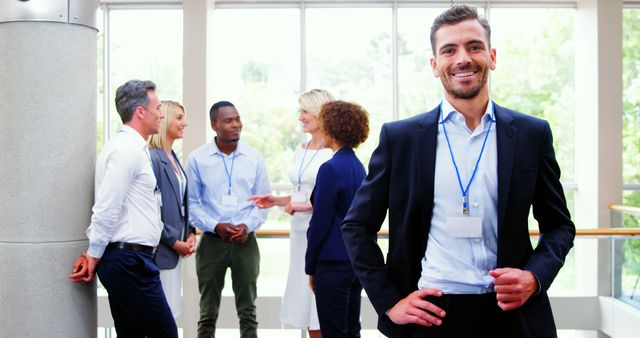 Confident Businessman Smiling at Corporate Meeting with Diverse Team - Download Free Stock Images Pikwizard.com