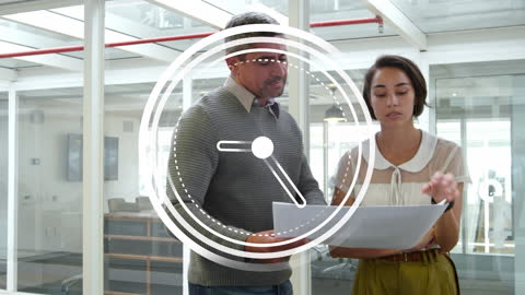 Diverse Colleagues Analyzing Documents in Office Setting