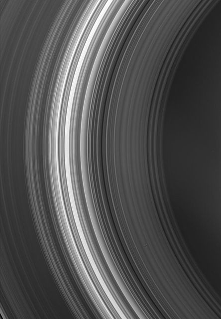 This detailed view showcases the inner rings of Saturn, captured by the Cassini spacecraft. Visible are the C and B rings, as well as the dark inner edge of the Cassini Division. This image is ideal for educational materials, presentations on planetary science, or as a high-resolution visual for space enthusiasts. Perfect for illustrating detailed aspects of ring composition and structure in scientific publications or astronomy websites.