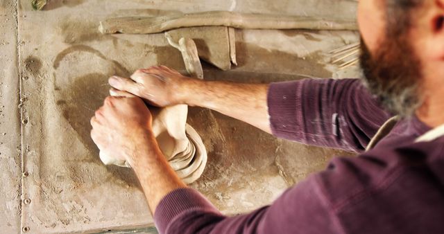 Sculptor's Hands Shaping Clay Artwork on Studio Wall - Download Free Stock Images Pikwizard.com