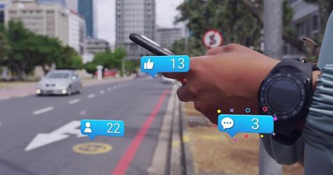 Woman holding smartphone on urban sidewalk receiving social notifications with smartwatch
