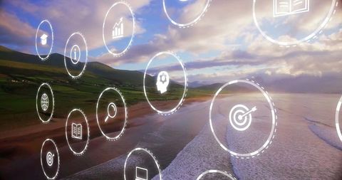 Digital icons overlay on scenic beach sunset with business and education symbols