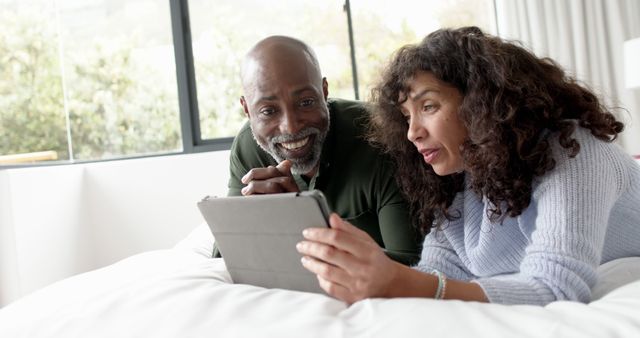 Couple Relaxing in Bed Using Digital Tablet Together - Download Free Stock Images Pikwizard.com