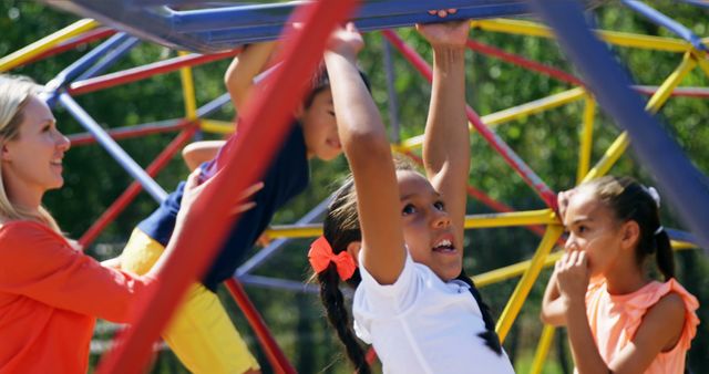 Children Playing on Jungle Gym Climbing Frame with Teacher - Download Free Stock Images Pikwizard.com