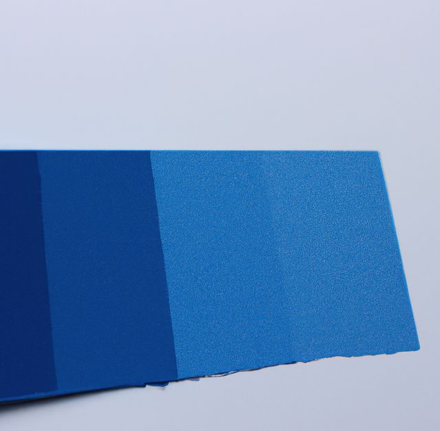 Close up of blue paint swatches on grey backrgound. Paint swatch, design and colors concept.