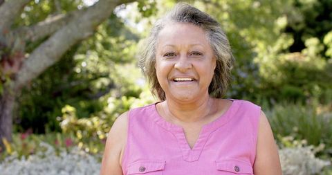 Senior Woman Smiling in Lush Garden Setting Sunny Day - Download Free Stock Images Pikwizard.com