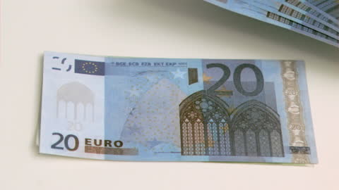 Close-Up of Rising 20 Euro Note on Table